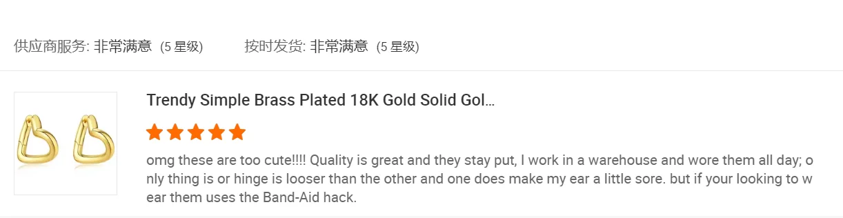 Customer review screenshot featuring gold-tone heart-shaped hoop earrings.